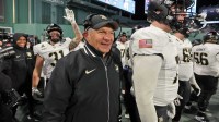 Army Black Knights head coach Jeff Monken celebrates a touchdown against the UConn Huskies during the second half of the Wasabi Fenway Bowl at Fenway Park.