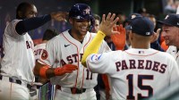 Houston Astros right fielder Cam Smith (11) celebrates his home run in the dugout with teammates against the Boston Red Sox in the seventh inning at Daikin Park.