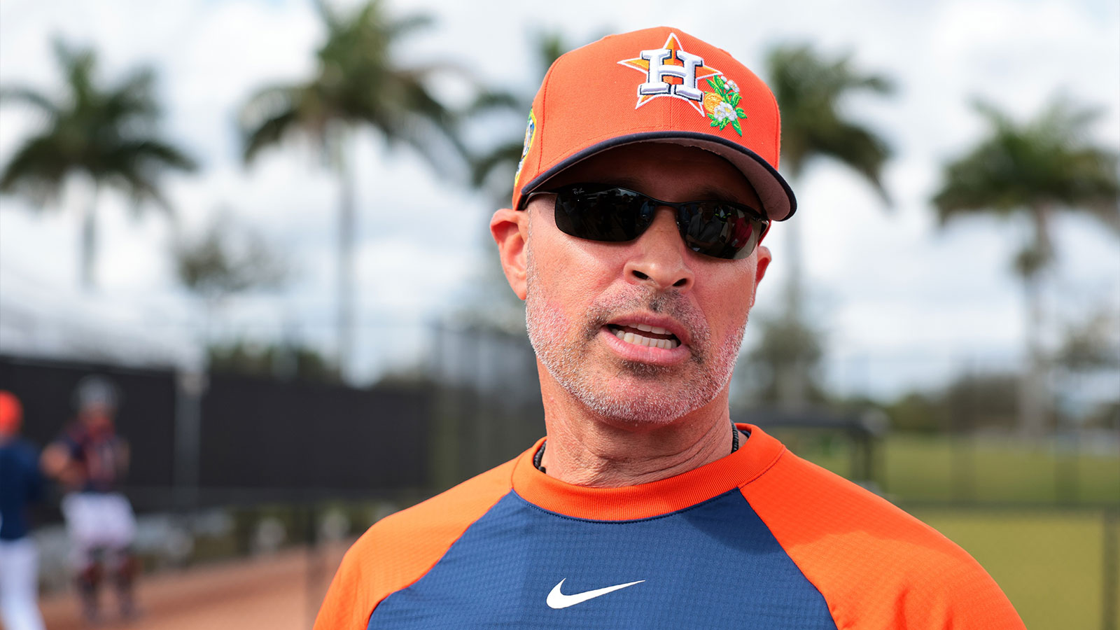 Houston Astros manager Joe Espada (19) speaks to reporters before a spring training workout at CACTI Park of The Palm Beaches. 