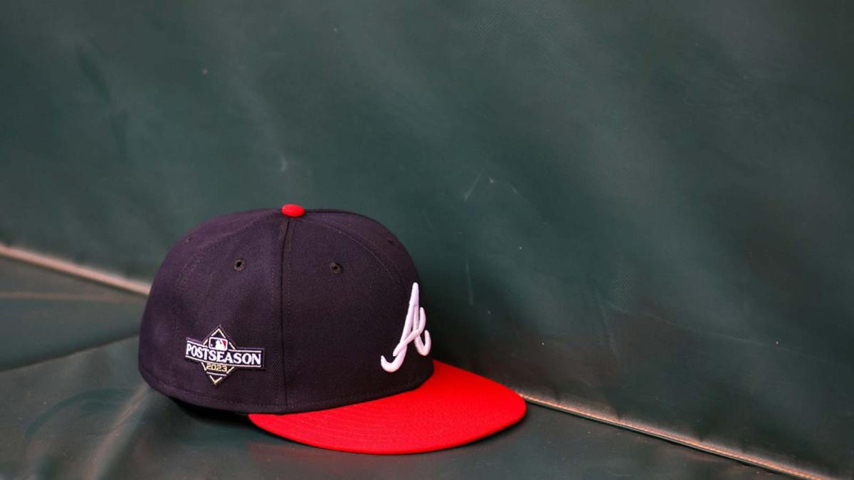 A detailed view of an Atlanta Braves postseason hat on the bench during a workout before the NLDS against the Philadelphia Phillies at Truist Park.