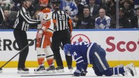 Anaheim Ducks defenseman Radko Gudas (7) looks at an injured Toronto Maple Leafs forward Auston Matthews (34) after he delivered a knee on knee hit during the second period at Scotiabank Arena.