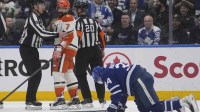 Anaheim Ducks defenseman Radko Gudas (7) looks at an injured Toronto Maple Leafs forward Auston Matthews (34) after he delivered a knee on knee hit during the second period at Scotiabank Arena.