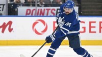 Toronto Maple Leafs forward Auston Matthews (34) shoots the puck against the Tampa Bay Lightning in the third period at Scotiabank Arena.
