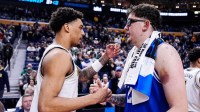 Michigan forward Yaxel Lendeborg (23) shakes hands with Saint Louis center Robbie Avila (21) after 95-72 win at the NCAA Tournament Second Round at KeyBank Center in Buffalo on Saturday, March 21, 2026.