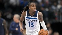 Minnesota Timberwolves guard Ayo Dosunmu (13) brings the ball up court against the Dallas Mavericks during the second quarter at the American Airlines Center.