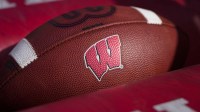 Sep 20, 2025; Madison, Wisconsin, USA; General view of the Wisconsin Badgers logo on a football during warmups prior to the game against the Maryland Terrapins at Camp Randall Stadium. Mandatory Credit: Jeff Hanisch-Imagn Images