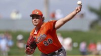 Baltimore Orioles catcher Maverick Handley (98) throws a pitch against the Atlanta Braves in the sixth inning during spring Training at CoolToday Park.