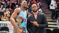 Miami Heat center Bam Adebayo (13) poses with former NBA player Dwyane Wade (right) after winning the skills challenge during NBA All Star Saturday Night at United Center.