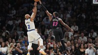 Miami Heat center Bam Adebayo (13) blocks the shot of Orlando Magic guard Jevon Carter (2) during the second half at Kaseya Center.