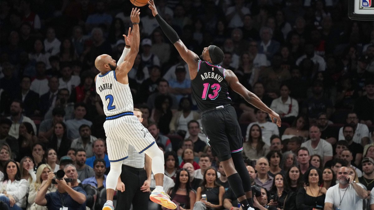 Miami Heat center Bam Adebayo (13) blocks the shot of Orlando Magic guard Jevon Carter (2) during the second half at Kaseya Center.
