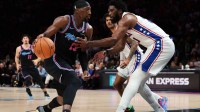 Miami Heat center Bam Adebayo (13) drives to the basket against Philadelphia 76ers center Joel Embiid (21) during the second quarter at Kaseya Center.