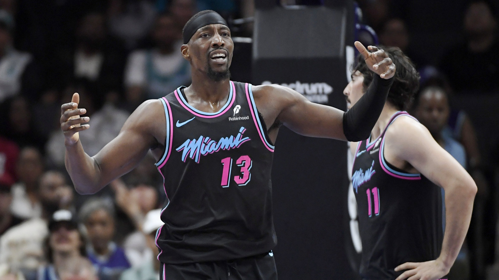 Miami Heat center Bam Adebayo (13) reacts after being called for a foul during the first half against the Charlotte Hornets at the Spectrum Center. 