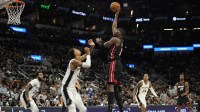 Miami Heat forward Bam Adebayo (13) shoots over San Antonio Spurs forward Victor Wembanyama (1) during the second half at Frost Bank Center.