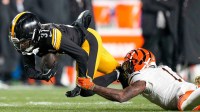 Pittsburgh Steelers cornerback Beanie Bishop Jr. (31) intercepts a pass stripped from Cincinnati Bengals wide receiver Ja'Marr Chase (1) in the second quarter of the NFL Week 18 game between the Pittsburgh Steelers and the Cincinnati Bengals at Acrisure Stadium in Pittsburgh on Saturday, Jan. 4, 2025.