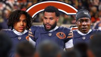 Akheem Mesidor, Emmanuel McNeil-Warren, and Jordyn Tyson all in Chicago Bears uniforms. There is also a logo for the Chicago Bears in the background.