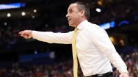 Iowa Hawkeyes head coach Ben McCollum instructs his team against the Florida Gators in the first half during a second round game of the men's 2026 NCAA Tournament at Benchmark International Arena.