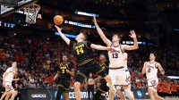 Iowa Hawkeyes guard Bennett Stirtz (14) shoots against Illinois Fighting Illini center Tomislav Ivisic (13) in the second half during an Elite Eight game of the South Regional of the men's 2026 NCAA Tournament at Toyota Center.