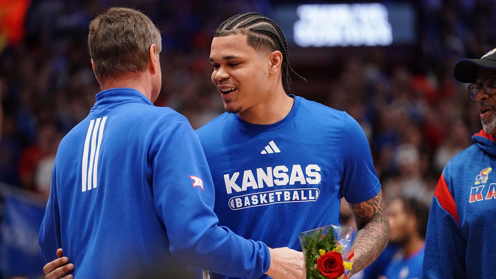 Kansas basketball guard Jayden Dawson is welcomed by Kansas Jayhawks head coach Bill Self before the Sunflower Showdown game against Kansas State Wildcats inside Allen Fieldhouse in Lawrence, Kansas, on Saturday, March 7, 2026.