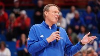 Kansas Jayhawks head coach Bill Self talks to the crowd following the Sunflower Showdown game inside Allen Fieldhouse in Lawrence, Kansas, on Saturday, March 7, 2026.