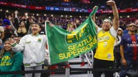 Oct 10, 2023; Seattle, Washington, USA; Fans hold a flag for the Seattle Supersonics during the fourth quarter of a game between the Utah Jazz and LA Clippers at Climate Pledge Arena. Mandatory Credit: Joe Nicholson-Imagn Images