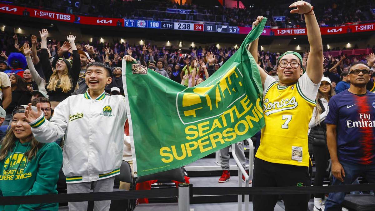 Oct 10, 2023; Seattle, Washington, USA; Fans hold a flag for the Seattle Supersonics during the fourth quarter of a game between the Utah Jazz and LA Clippers at Climate Pledge Arena. Mandatory Credit: Joe Nicholson-Imagn Images