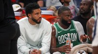 Oct 8, 2025; Memphis, Tennessee, USA; Boston Celtics forward Jayson Tatum (0) and guard Jaylen Brown (7) look on from the bench during the second quarter against the Memphis Grizzlies at FedExForum. Mandatory Credit: Petre Thomas-Imagn Images
