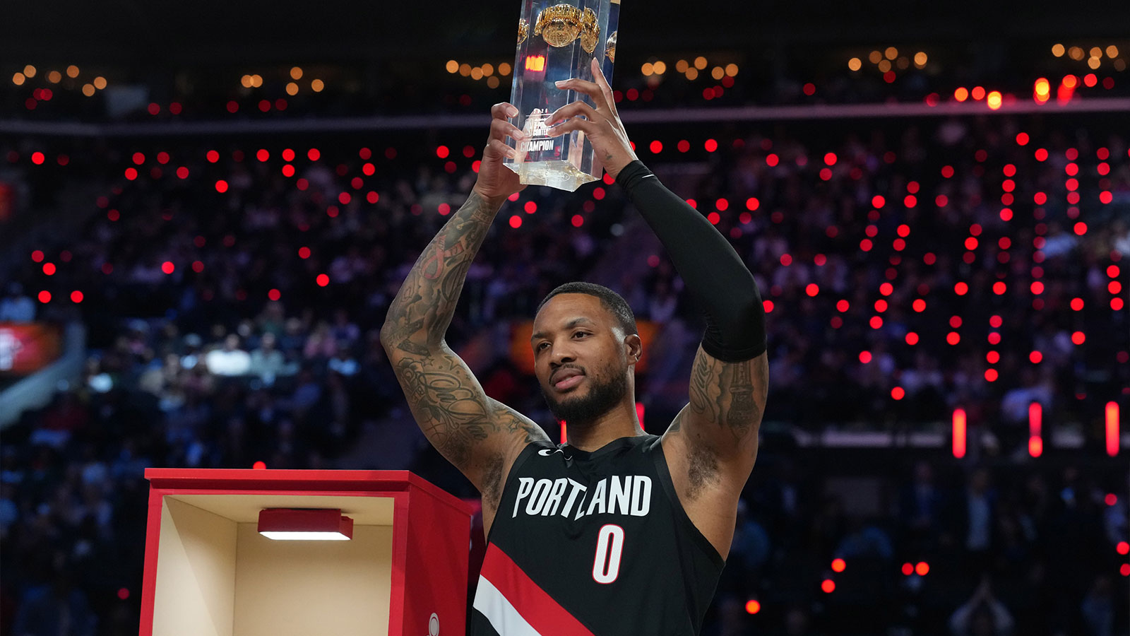 Blazers guard Damian Lillard (0) holds the trophy after winning the three point contest during the 2026 NBA All Star Saturday Night at Intuit Dome