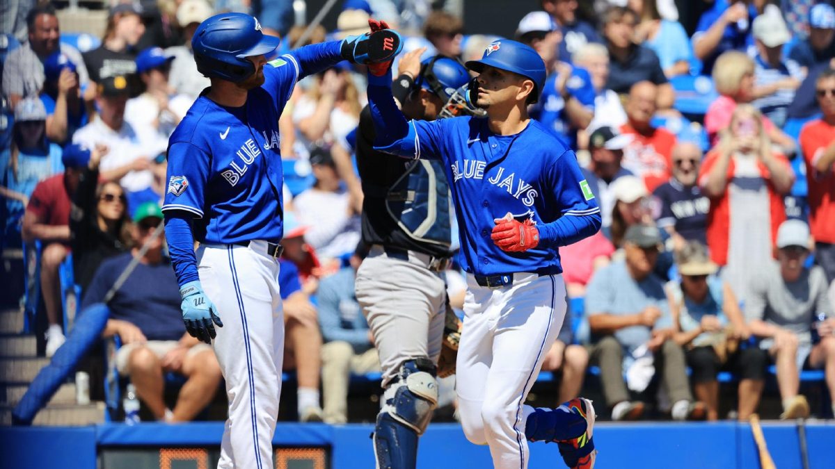 Toronto Blue Jays second baseman Andres Gimenez (0) is congratulated after hitting a two-run home run during the fifth inning against the New York Yankees at TD Ballpark.