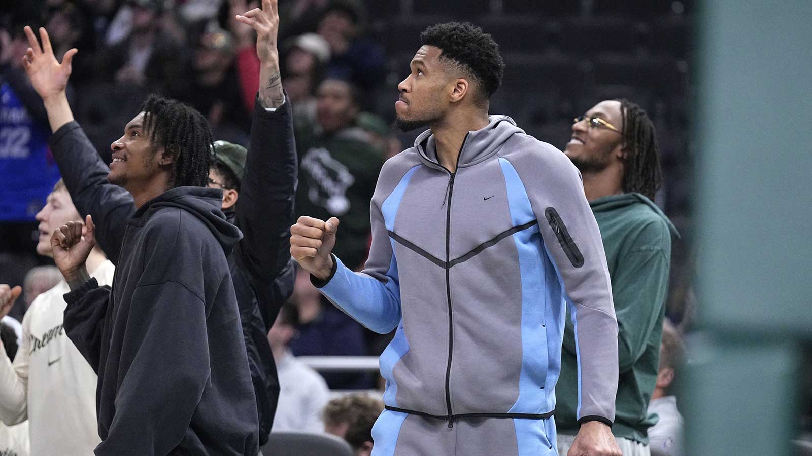 Milwaukee Bucks guard/forward Kevin Porter Jr. (7), Milwaukee Bucks forward Giannis Antetokounmpo (34) and Milwaukee Bucks center/forward Myles Turner (3) react to a late fourth quarter rally by the Milwaukee Bucks against the LA Clippers in the second half at Fiserv Forum.