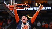 Illinois Fighting Illini head coach Brad Underwood celebrates after cutting down the net after defeating the Iowa Hawkeyes in an Elite Eight game of the South Regional of the men's 2026 NCAA Tournament at Toyota Center.