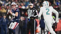 New England Patriots quarterback Drake Maye (10) looks to throw a pass against Miami Dolphins linebacker Bradley Chubb (2) during the second quarter at Gillette Stadium.