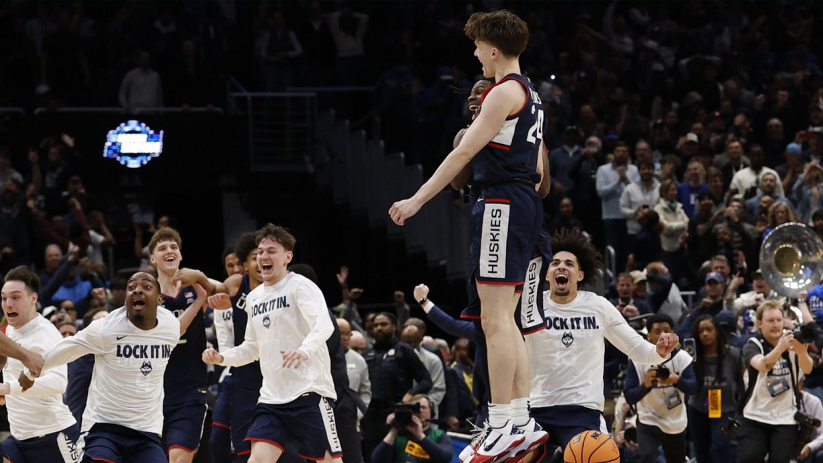 UConn Huskies guard Braylon Mullins (24) celebrates after making the game-winning three-point basket against the Duke Blue Devils in the second half during an Elite Eight game of the East Regional of the men's 2026 NCAA Tournament at Capital One Arena. Mandatory Credit: Geoff Burke-Imagn Images