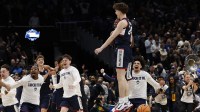UConn Huskies guard Braylon Mullins (24) celebrates after making the game-winning three-point basket against the Duke Blue Devils in the second half during an Elite Eight game of the East Regional of the men's 2026 NCAA Tournament at Capital One Arena. Mandatory Credit: Geoff Burke-Imagn Images