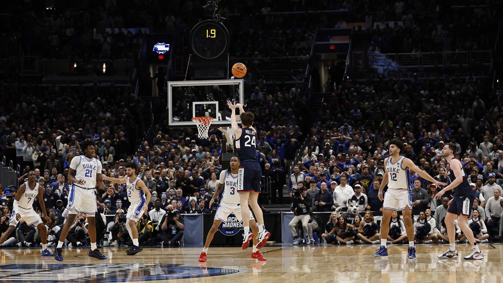 UConn Huskies guard Braylon Mullins (24) makes the game-winning three point field goal against the Duke Blue Devils in the final second of the game during an Elite Eight game of the East Regional of the men's 2026 NCAA Tournament at Capital One Arena. 