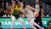 New York Liberty forward Breanna Stewart (30) dribbles the ball against Seattle Storm forward Nneka Ogwumike (3) during the first half at Climate Pledge Arena.