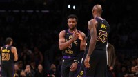 Los Angeles Lakers forward LeBron James (23) greets guard Bronny James (9) as Bronny enters the game for LeBron during the fourth quarter against the Atlanta Hawks at Crypto.com Arena.