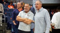 Former Auburn Tigers basketball coach Bruce Pearl and football coach Gus Malzahn talk before the game as Auburn Tigers take on LSU Tigers at Neville Arena in Auburn, Ala. on Tuesday, March 3, 2026.