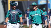 Feb 26, 2026; Peoria, Arizona, USA; Seattle Mariners catcher Cal Raleigh (29) and pitcher Bryce Miller (50) walk to the dugout before the game against the Cleveland Guardians at Peoria Sports Complex