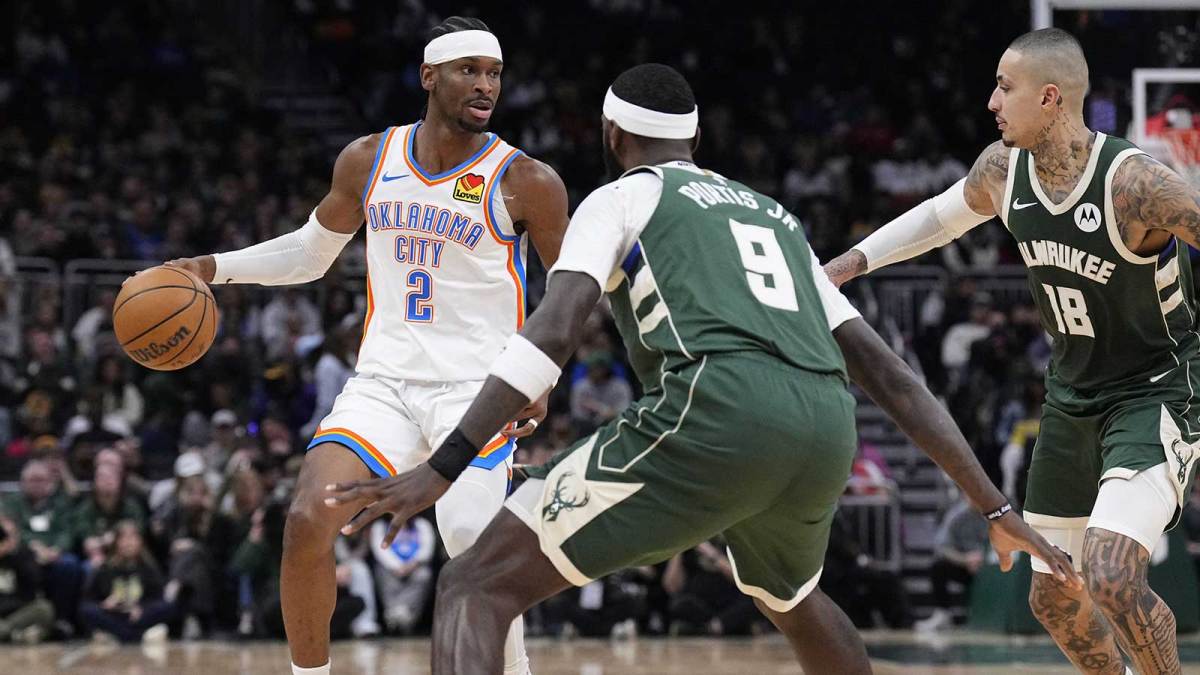 Thunder guard Shai Gilgeous-Alexander (2) drives to the basket against Milwaukee Bucks forward Bobby Portis (9) and Milwaukee Bucks forward Kyle Kuzma (18) in the first half at Fiserv Forum Is Kyle Kuzma playing tonight vs. Blazers Is Bobby Portis playing tonight vs. Blazers