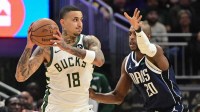 Bucks forward Kyle Kuzma (18) looks for a shot