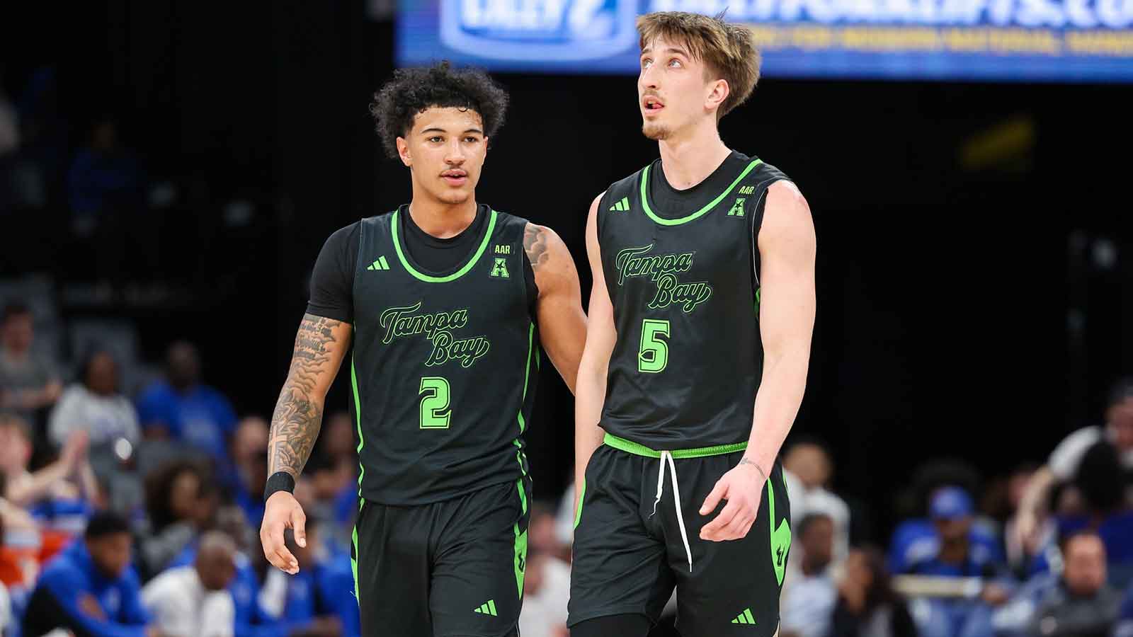 South Florida Bulls guard Wes Enis (2) and guard Joseph Pinion (5) look on against the Memphis Tigers during the first half at FedExForum.