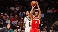 Atlanta Hawks guard CJ McCollum (3) shoots past Milwaukee Bucks guard Gary Harris (11) in the fourth quarter at State Farm Arena.