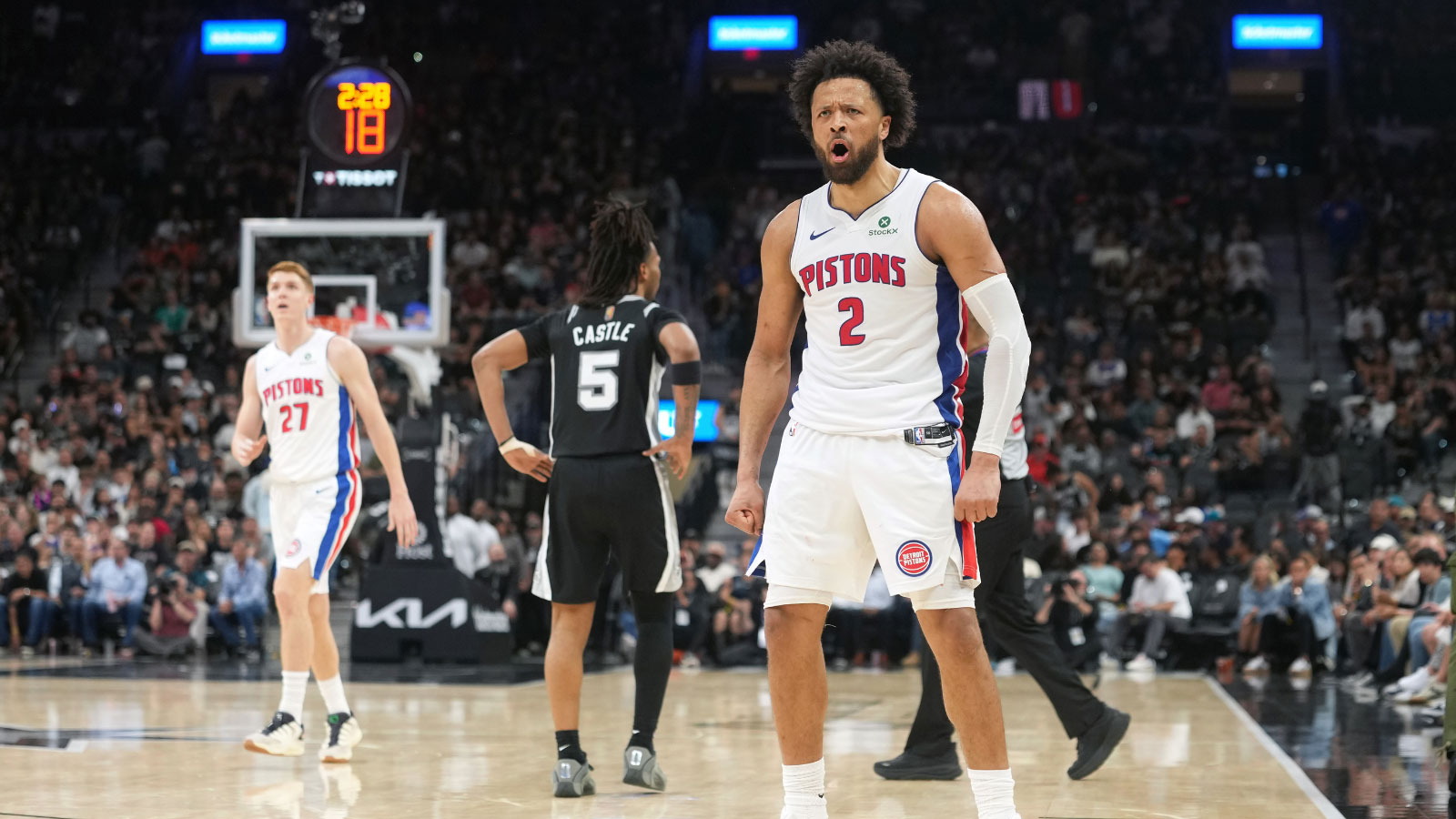 Detroit Pistons guard Cade Cunningham (2) reacts after drawing a foul while scoring a three point basket during the second half against the San Antonio Spurs at Frost Bank Center.