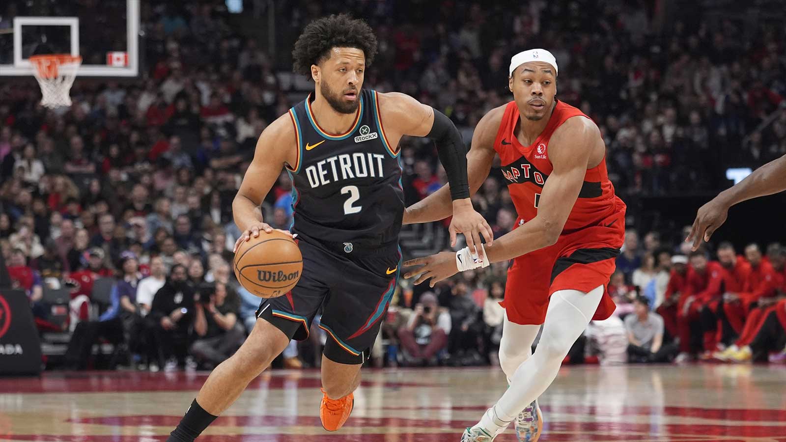 Detroit Pistons guard Cade Cunningham (2) drives to the basket against Toronto Raptors guard Scottie Barnes (4) during the first half at Scotiabank Arena.