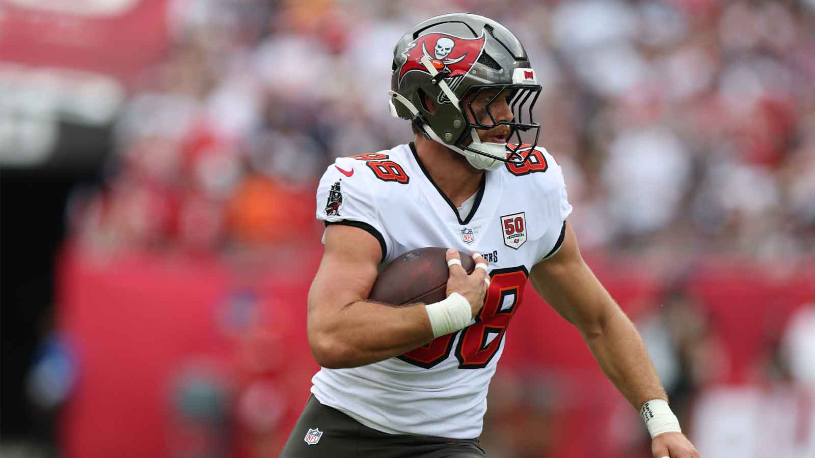 Tampa Bay Buccaneers tight end Cade Otton (88) runs for a gain during the first quarter against the New England Patriots at Raymond James Stadium.