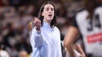 Indiana Fever guard Caitlin Clark (22) on the sideline against the Atlanta Dream in the first quarter during game one of round one for the 2025 WNBA Playoffs at Gateway Center Arena at College Park.