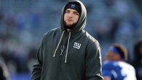 New York Giants running back Cam Skattebo (44) watches practice before the game against the Minnesota Vikings at MetLife Stadium.
