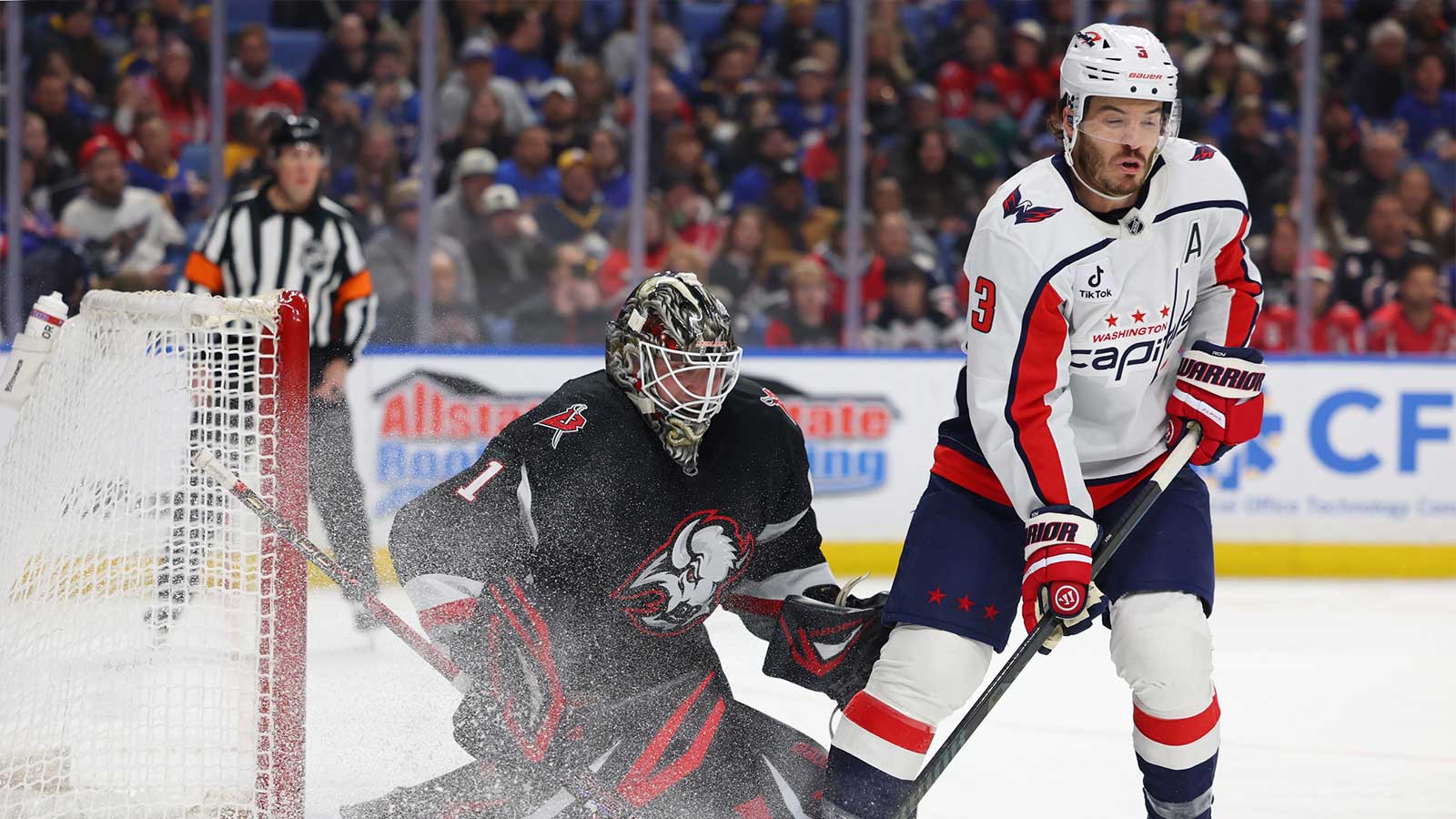 Washington Capitals defenseman Matt Roy (3) tries to deflect a shot on Buffalo Sabres goaltender Ukko-Pekka Luukkonen (1) during the first period at KeyBank Center.
