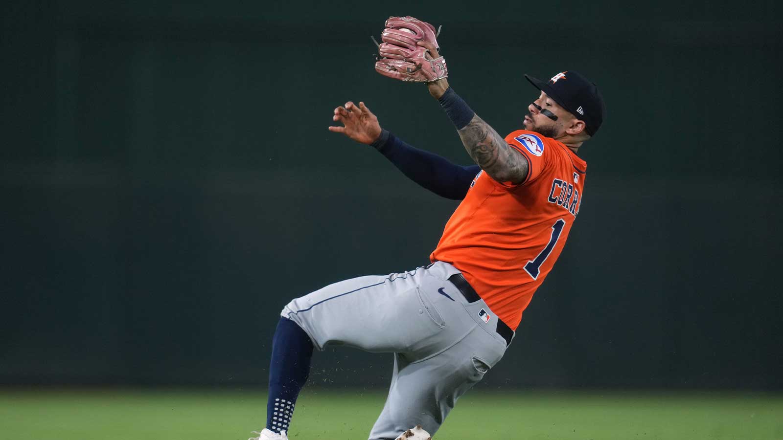 Houston Astros shortstop Carlos Correa (1) loses his footing after fielding a ground ball against the Athletics in the third inning at Sutter Health Park.