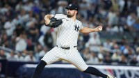 New York Yankees starting pitcher Carlos Rodon (55) pitches against the Toronto Blue Jays in the first inning during game three of the ALDS round for the 2025 MLB playoffs at Yankee Stadium.